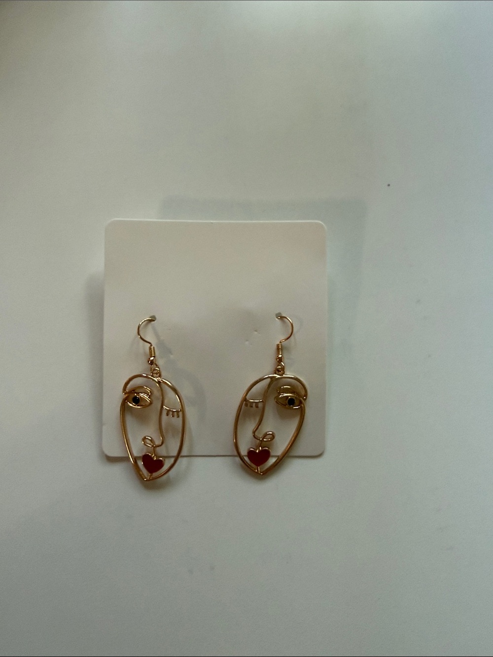 F2 Gold Face Outline Drop Earrings with Red Heart Accent